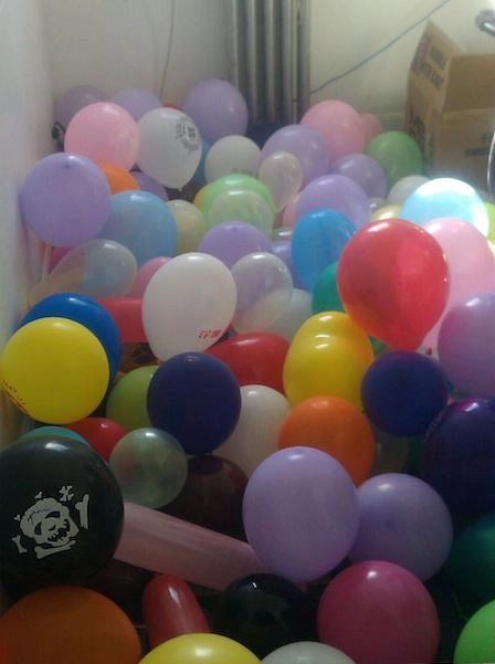 Office filled with balloons for prank