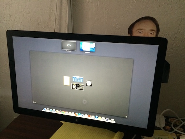 Printout of Nicholas Cage behind monitor for prank