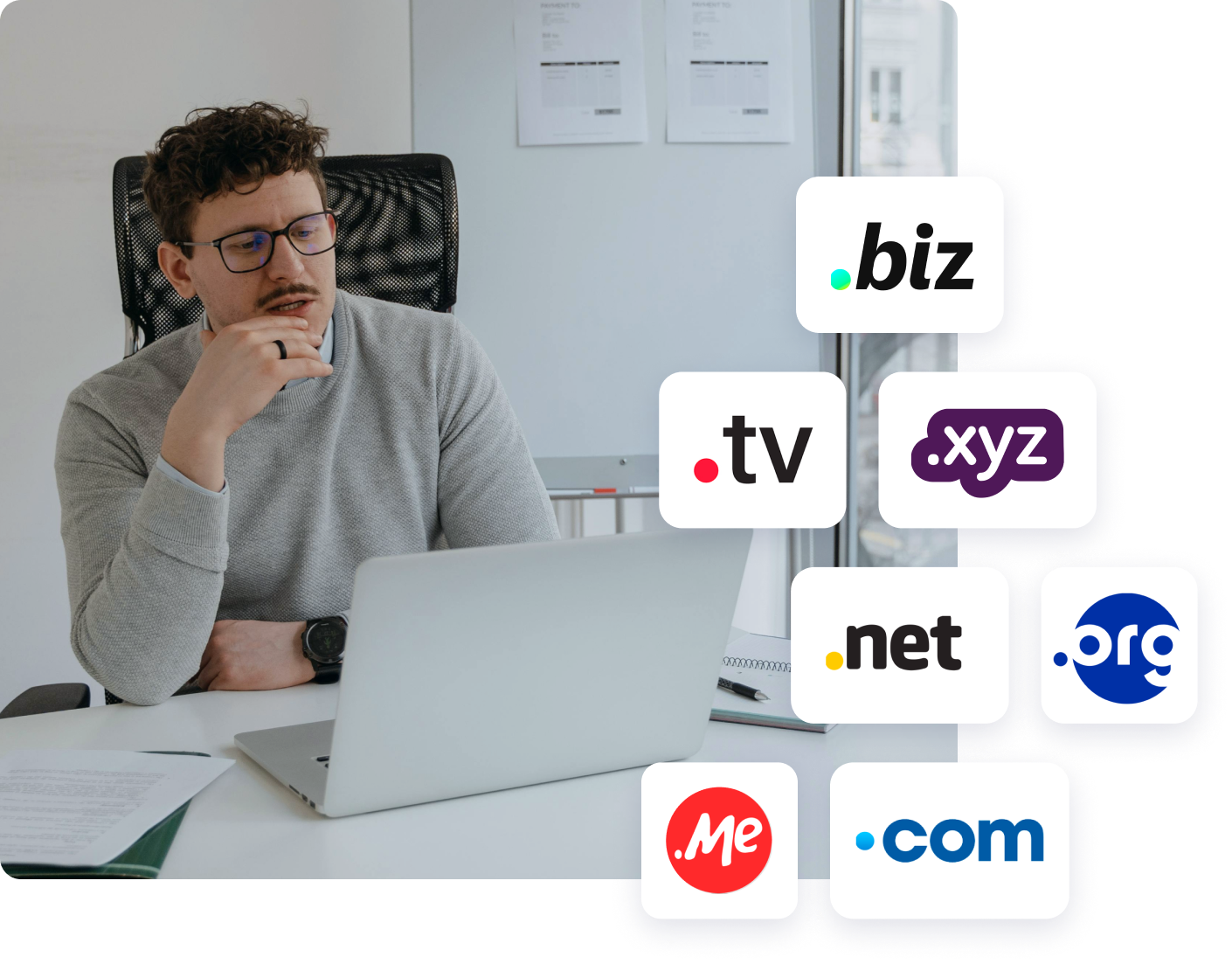Photo of a person working on a laptop at a desk, with floating icons representing domain extensions including .com, .net, .org, .biz, .tv, .xyz, and .me.