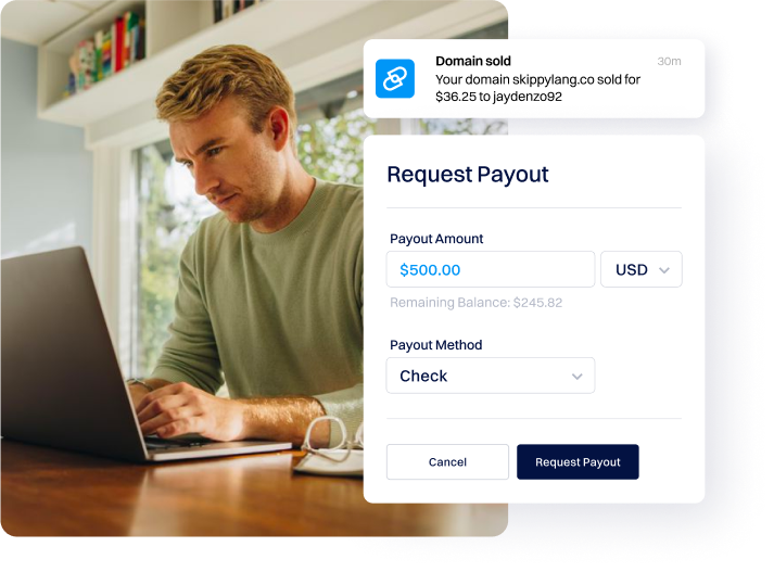 man at desk on laptop requesting a payout at dynadot